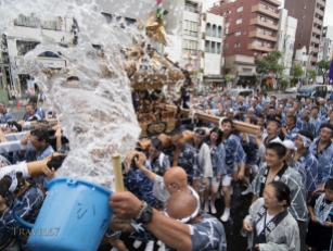 Fukagawa Fetival aka water throwing festival held at Tomioka Hachimangu Shrine, Tokyo, Japan on Sunday Aug 16, 2014. Water thrown at mikoshi (portable shirines) carried through streets in one of the great Shinto festivals of Tokyo.