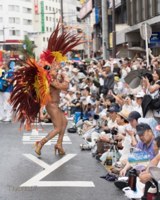 Dancing in the streets at the 33rd Asakusa Samba Festival in Tokyo, Japan. Sat. 14 August 2014. 22 teams including local Japanese and Brazilians bring Samba to the roads around Asakusa Shrine. Watched by around 500,000 spectators.